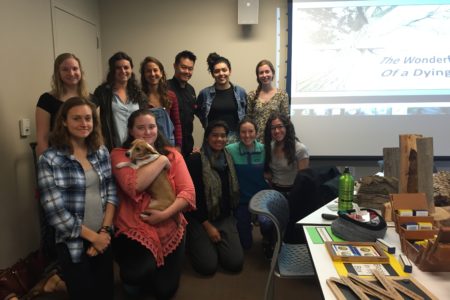 Students at Pitzer College carry a lantern for the CCI